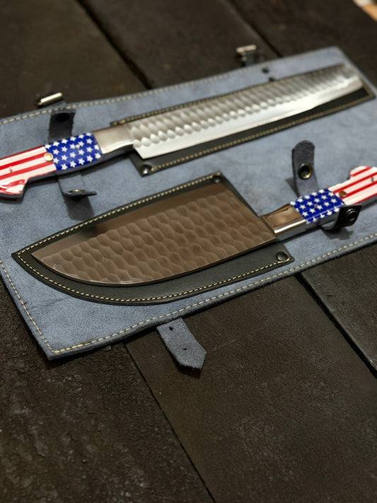 Two knives with American flag designs on a dark surface