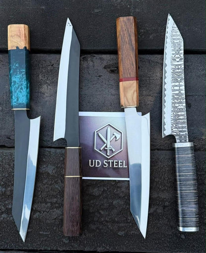Set of knives with wooden handles on a dark surface, featuring the UD Steel logo.