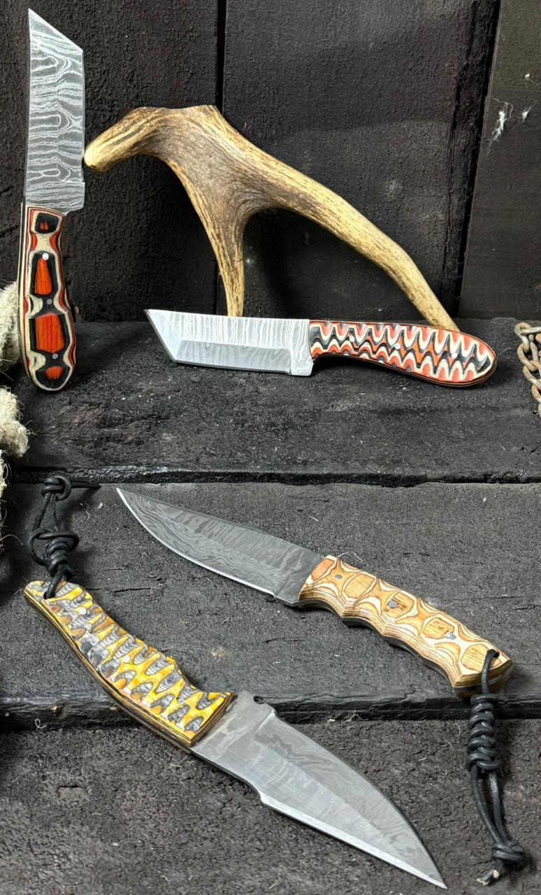 Collection of knives with decorative handles on a dark surface