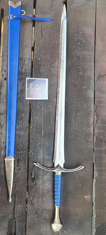 Sword with blue sheath and silver blade on a wooden background