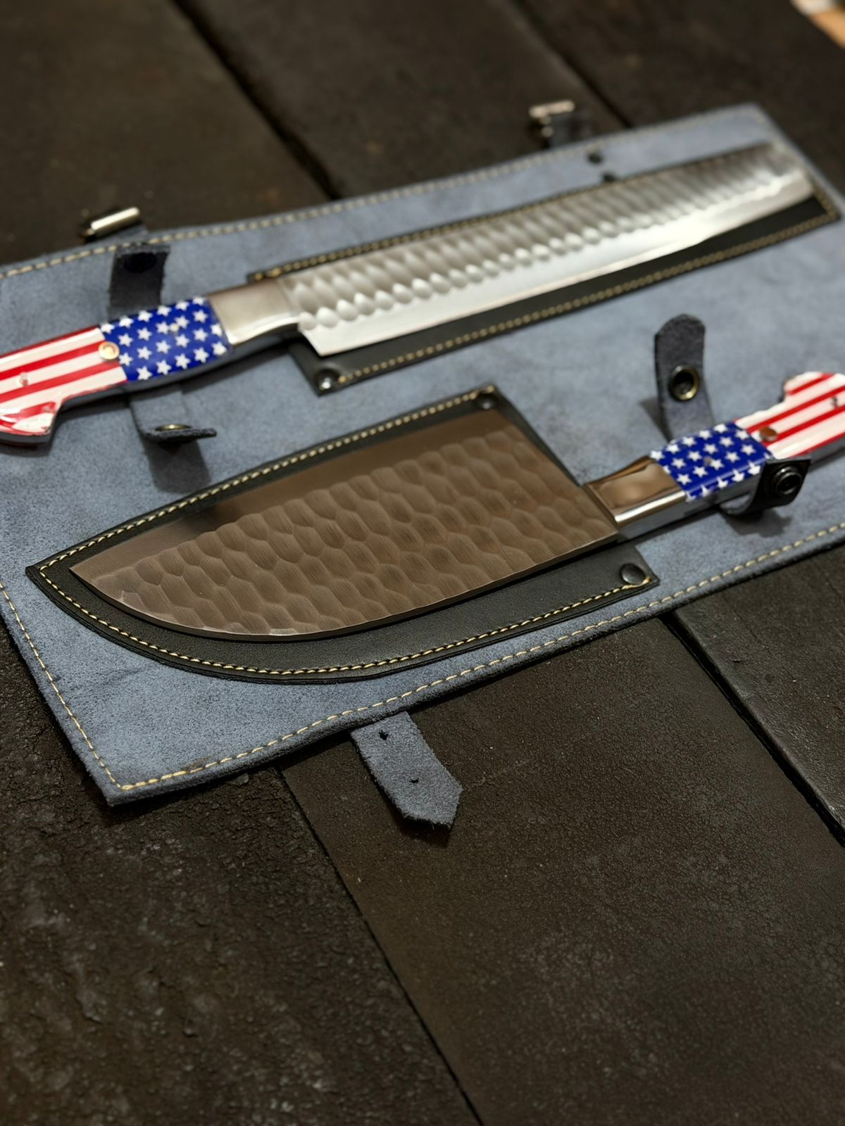 Two knives with American flag designs on a dark surface