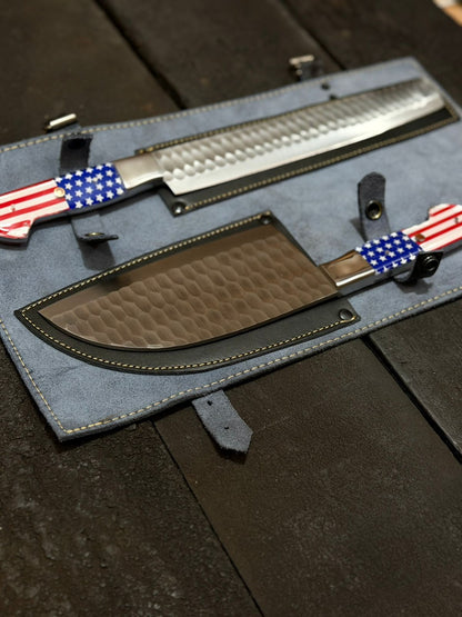 Two knives with American flag designs on a dark surface