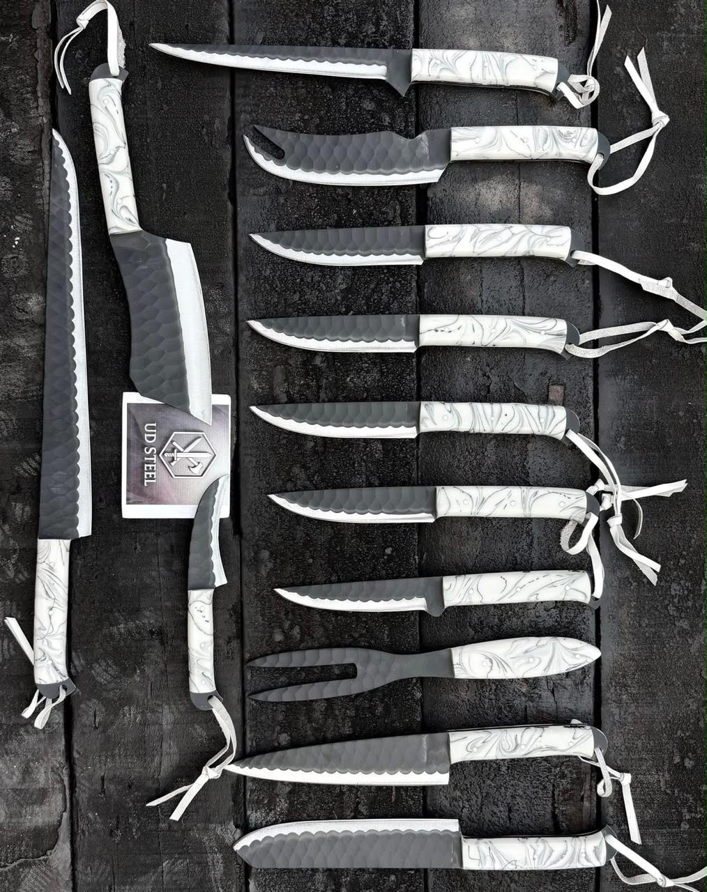 Set of knives with sheaths on a dark background