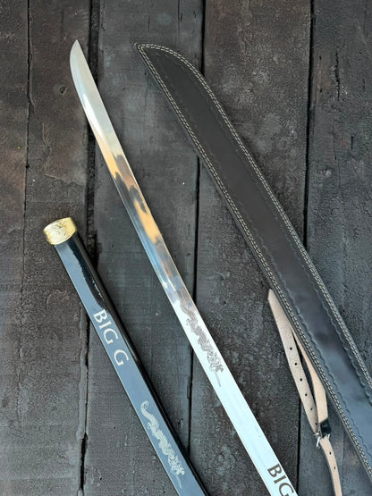 Sword with sheath on a dark wooden surface