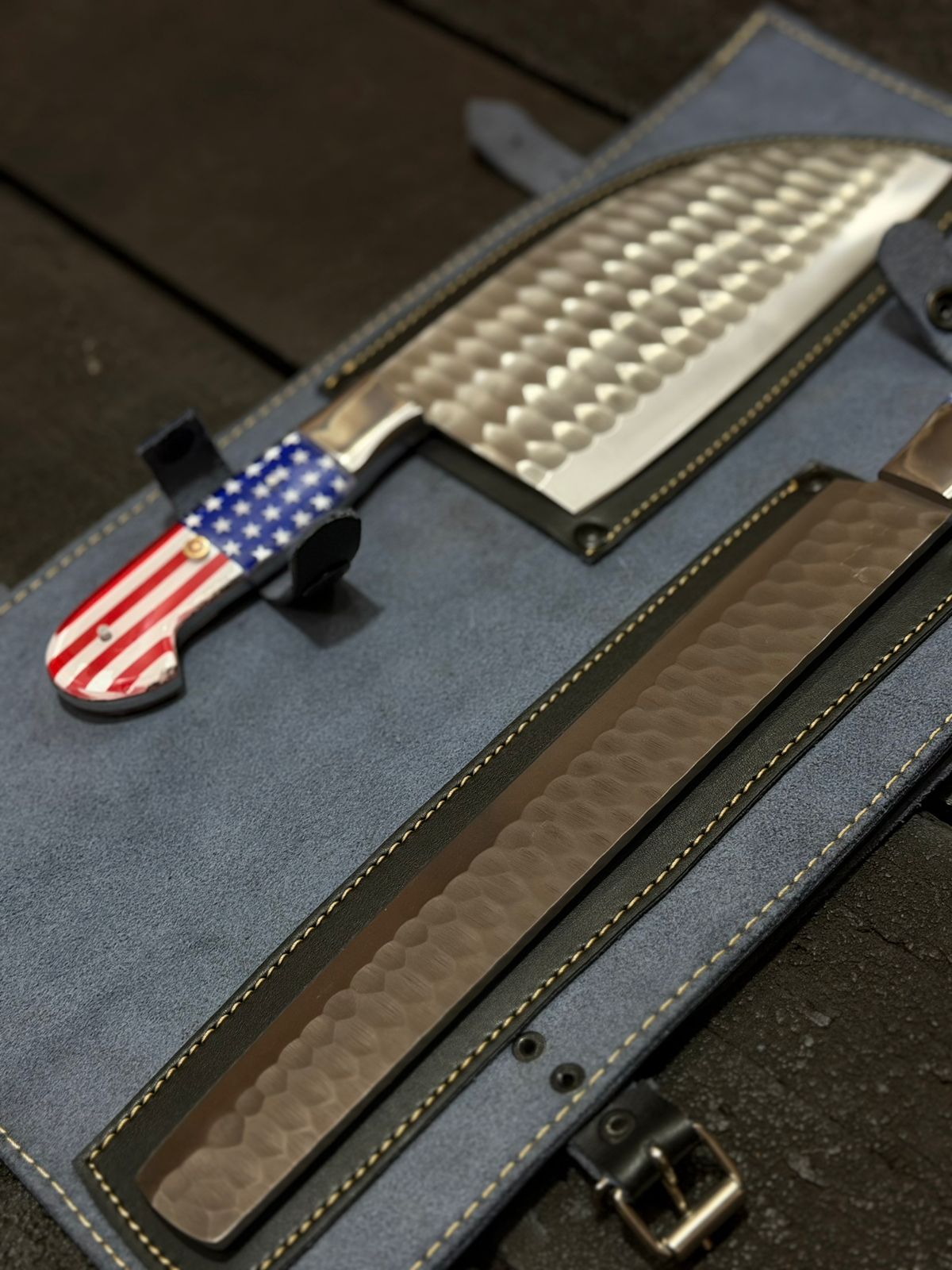 Knife with American flag handle on a blue sheath