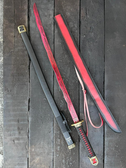 Sword with red sheath on a wooden surface