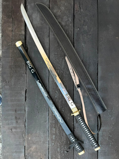 swords with sheaths on a dark wooden surface
