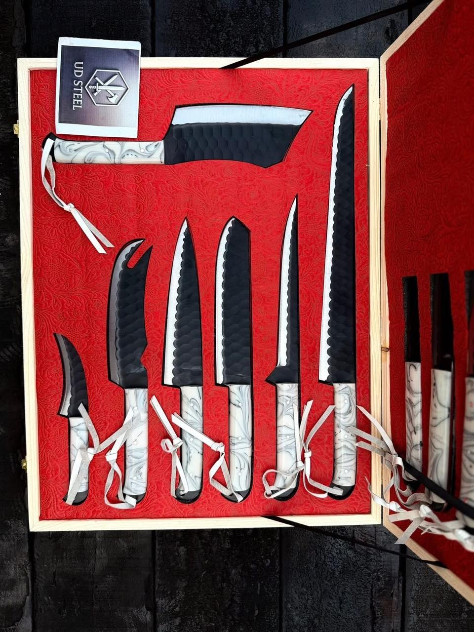 Set of knives in a red box with UD Steel branding