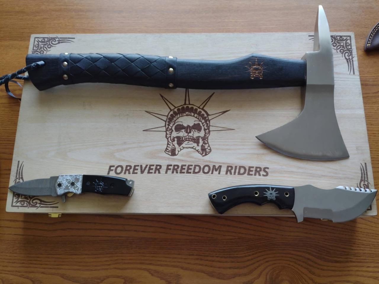 Axes on a wooden stand with 'Forever Freedom Riders' branding