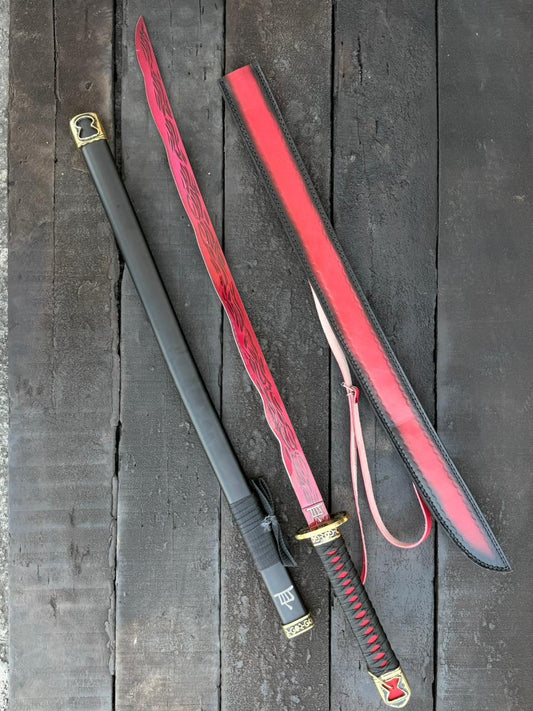 Sword with red sheath on a wooden surface