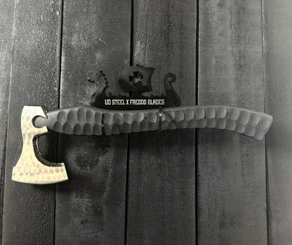 Axes with different handles on a wooden surface