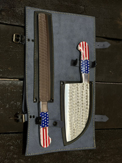 Set of knives with American flag patterns in a gray leather sheath on a dark wooden surface.