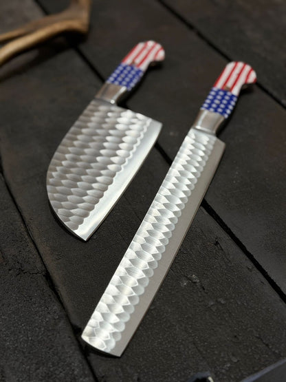Two knives with decorative handles on a dark surface
