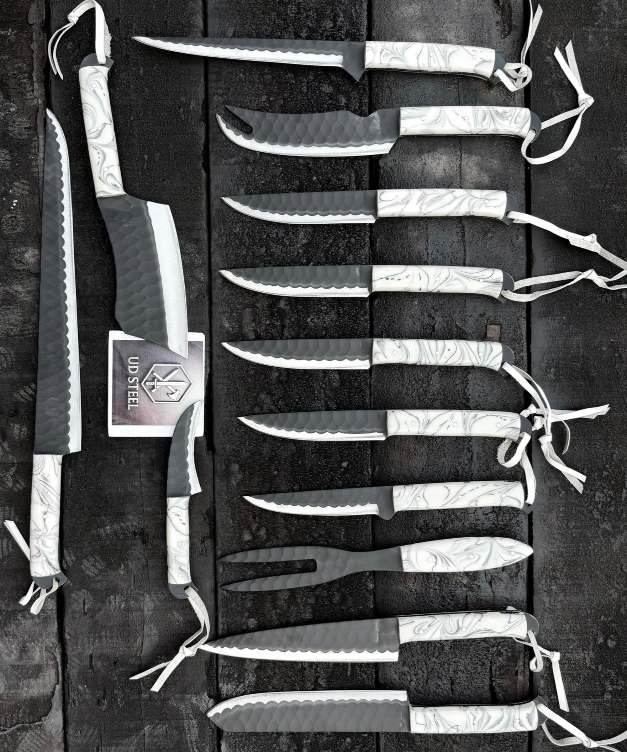 Set of knives with sheaths on a dark background